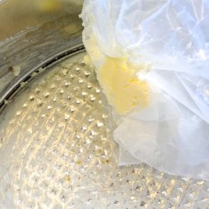 I use a piece of wax paper to hold a knob of butter.