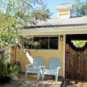 The woodshed sporting the new colours, except for the gate, which will stay weathered.